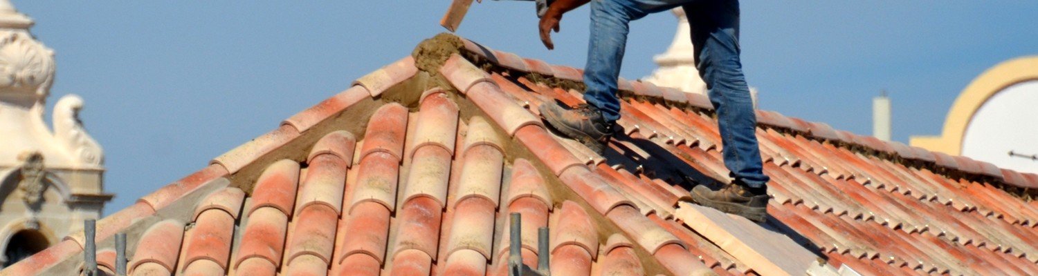 roofer working on a home in milton ontario